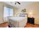 Bedroom with ceiling fan, natural light, and hardwood flooring at 2545 Nashira St, Henderson, NV 89044