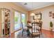 Bright dining area showcasing glass table set and access to the patio at 2545 Nashira St, Henderson, NV 89044