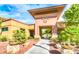Community center entrance featuring decorative landscaping, rock accents, and building signage at 2545 Nashira St, Henderson, NV 89044