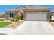 Charming single-story home featuring a two-car garage and stone accents at 2545 Nashira St, Henderson, NV 89044