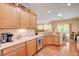 Kitchen with stainless steel appliances, ample counter space, and light wood cabinets at 2545 Nashira St, Henderson, NV 89044
