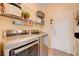 Convenient laundry room featuring modern washer and dryer, ample storage, and shelving at 2545 Nashira St, Henderson, NV 89044