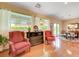 Open seating area with hardwood floors and multiple windows with view at 2545 Nashira St, Henderson, NV 89044