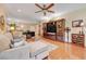 Comfortable living room with a ceiling fan and an entertainment center at 2545 Nashira St, Henderson, NV 89044