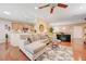 Open concept living area with wood floors and natural light from many windows at 2545 Nashira St, Henderson, NV 89044