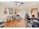 Cozy bonus room with guitars, ample seating, and hardwood floors, offering a versatile living space at 2545 Nashira St, Henderson, NV 89044