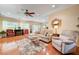Inviting living room with comfortable seating, hardwood floors, and bright natural light at 2545 Nashira St, Henderson, NV 89044