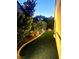 Cozy side yard with artificial turf, garden lighting, and mature landscaping at 2545 Nashira St, Henderson, NV 89044