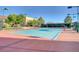 Well-lit community tennis court with benches, net, and perimeter fencing at 2545 Nashira St, Henderson, NV 89044