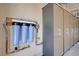 Garage utility room with water filtration system and wall cabinets at 2545 Nashira St, Henderson, NV 89044