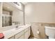 Bright bathroom with a vanity and mirror, white countertops, and shower at 27 Sirnoble St, Las Vegas, NV 89110