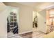 Bedroom featuring walk-in closets and wood-look flooring, with a neutral color palette at 27 Sirnoble St, Las Vegas, NV 89110