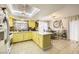 A sun-lit eat-in kitchen featuring a breakfast bar, and modern appliances at 27 Sirnoble St, Las Vegas, NV 89110