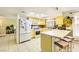 The kitchen features a breakfast bar, modern appliances and a window over the sink at 27 Sirnoble St, Las Vegas, NV 89110