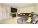 Cozy living room features fireplace, tile floor, and a comfortable gray sectional sofa at 27 Sirnoble St, Las Vegas, NV 89110