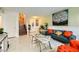 A cozy living room with tiled floors and easy access to both the front door and upstairs at 27 Sirnoble St, Las Vegas, NV 89110