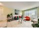 A comfortable living room with tiled floors, plenty of natural light, and stylish furniture at 27 Sirnoble St, Las Vegas, NV 89110