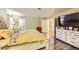 Spacious bedroom with hardwood flooring, dresser, and a neutral color palette at 27 Sirnoble St, Las Vegas, NV 89110