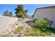Backyard featuring a block fence and desert landscaping at 2700 Osborne Ln, Henderson, NV 89014