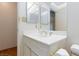 Bathroom showcasing a marble countertop vanity and modern fixtures at 2700 Osborne Ln, Henderson, NV 89014