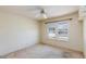 Bedroom with a ceiling fan and dual windows at 2700 Osborne Ln, Henderson, NV 89014