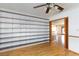 Bedroom featuring hardwood floors and large shelving, ideal for storage at 2700 Osborne Ln, Henderson, NV 89014