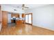 An open kitchen with wood cabinets and a peninsula, flowing into the living area at 2700 Osborne Ln, Henderson, NV 89014