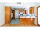 Kitchen features a gas range, light countertops and wood cabinetry at 2700 Osborne Ln, Henderson, NV 89014