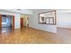 Spacious living room showcasing hardwood floors and seamless flow into adjacent rooms at 2700 Osborne Ln, Henderson, NV 89014