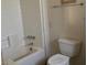 Bright white bathroom with a tub and toilet at 2700 W Prospector Ln, Pahrump, NV 89048