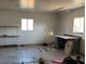 Spacious garage with two windows and shelving at 2700 W Prospector Ln, Pahrump, NV 89048