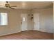 Living room with hardwood floors, two doors, and a large window for natural light at 2700 W Prospector Ln, Pahrump, NV 89048