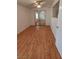 Bedroom with wood flooring, a mirrored closet, and a bright window at 2721 Coffee Pot Ct, Las Vegas, NV 89106