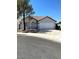 Charming single-story home features a two-car garage, red-tiled roof and neutral paint at 2721 Coffee Pot Ct, Las Vegas, NV 89106