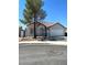 Charming single-story home features a two-car garage, red-tiled roof and neutral paint at 2721 Coffee Pot Ct, Las Vegas, NV 89106