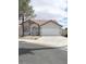 Charming single-story home featuring a two-car garage and a well-maintained front yard at 2721 Coffee Pot Ct, Las Vegas, NV 89106