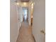 Hallway with neutral paint and tile flooring leading to various rooms at 2721 Coffee Pot Ct, Las Vegas, NV 89106