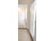 Hallway featuring tile flooring and natural light streaming in through the window at 2721 Coffee Pot Ct, Las Vegas, NV 89106