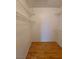 Walk-in closet featuring wood laminate floors and wire shelving for storage at 2721 Coffee Pot Ct, Las Vegas, NV 89106