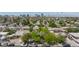 Neighborhood aerial showcasing lush greenery and proximity to the city skyline in the distance at 2825 Burnham Ave, Las Vegas, NV 89169