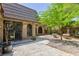 View of backyard with a concrete walkway, desert landscaping and gated access to house at 2825 Burnham Ave, Las Vegas, NV 89169