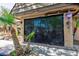 Secured front entrance featuring black metal doors and landscaped surroundings with palm trees at 2825 Burnham Ave, Las Vegas, NV 89169