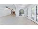 Spacious living area with tile floors, an archway, white walls and a fireplace focal point at 2825 Burnham Ave, Las Vegas, NV 89169