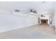Spacious living room with tile flooring, ceiling fans, and a fireplace at 2825 Burnham Ave, Las Vegas, NV 89169
