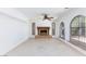 Bright living room featuring tile flooring and a cozy fireplace at 2825 Burnham Ave, Las Vegas, NV 89169