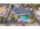 Aerial view of a luxurious estate with a modern house, pool, patio, and landscaped grounds at 3189 Montecito Dr, Las Vegas, NV 89120