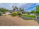 Expansive backyard showcasing beautiful landscaping, a modern pool, and mature trees creating a private oasis at 3189 Montecito Dr, Las Vegas, NV 89120