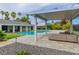 Relaxing backyard with a pool, seating area, and a view of the main house, perfect for outdoor enjoyment at 3189 Montecito Dr, Las Vegas, NV 89120