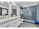 Elegant bathroom with a double vanity, walk-in shower, and stylish fixtures at 3189 Montecito Dr, Las Vegas, NV 89120