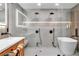 Sleek modern bathroom with a freestanding tub, walk-in shower, and stylish vanities at 3189 Montecito Dr, Las Vegas, NV 89120